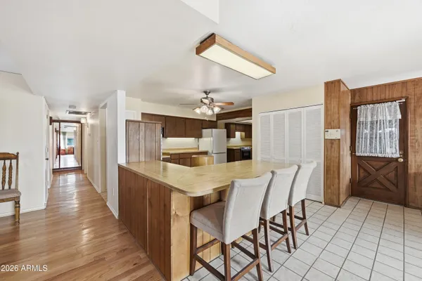 a kitchen with stainless steel appliances granite countertop a stove a sink dishwasher and a refrigerator