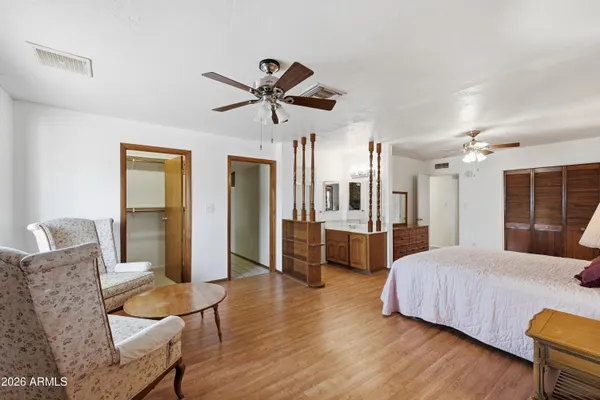 a bathroom with a sink vanity mirror and toilet