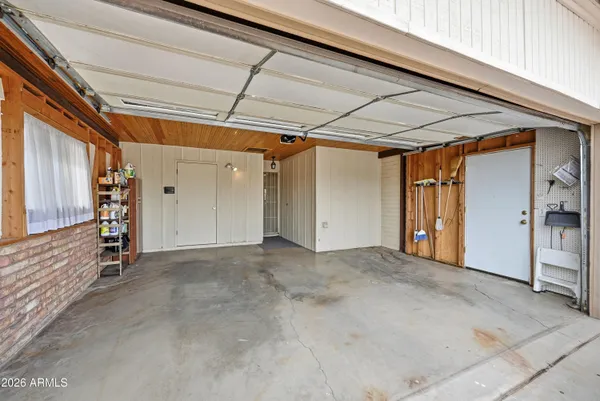 a view of a backyard with a garden and entertaining space