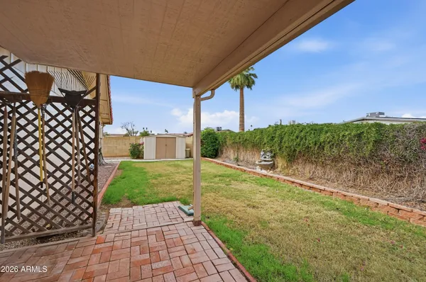 an aerial view of residential houses with city view