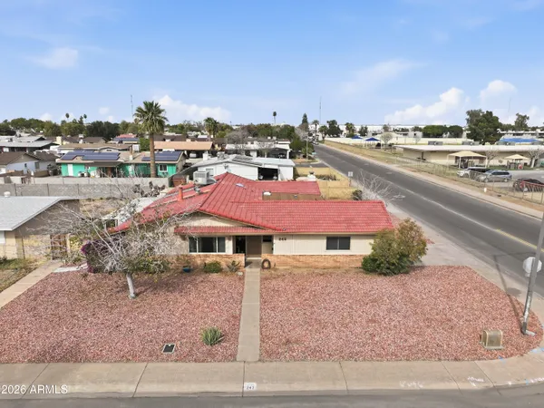 an aerial view of residential houses with outdoor space