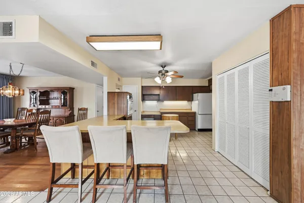 a kitchen with a sink cabinets and appliances