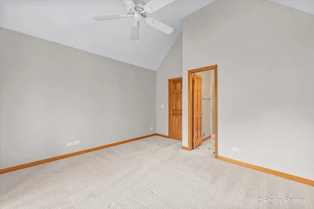 an empty room with a empty space and a ceiling fan
