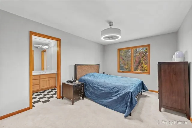 a bedroom with a bed and cabinets