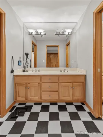 a room with a black white checkered floor and a black white checkered floor