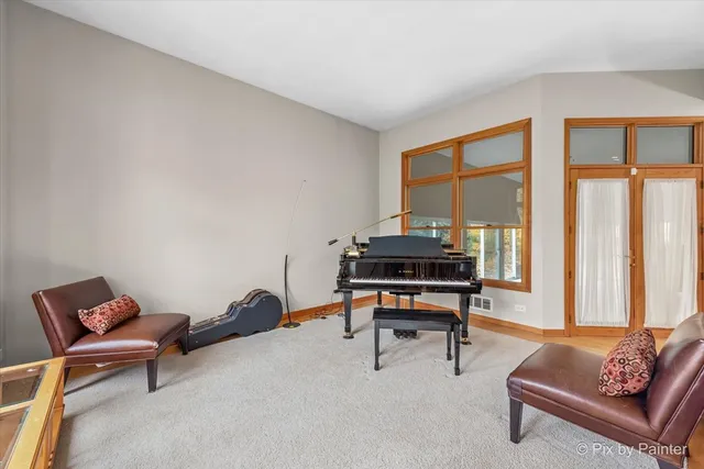 a reading room with furniture and a window