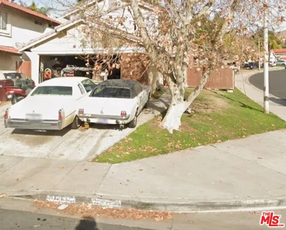 a view of a street with cars