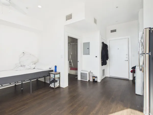 a view of kitchen with furniture and wooden floor