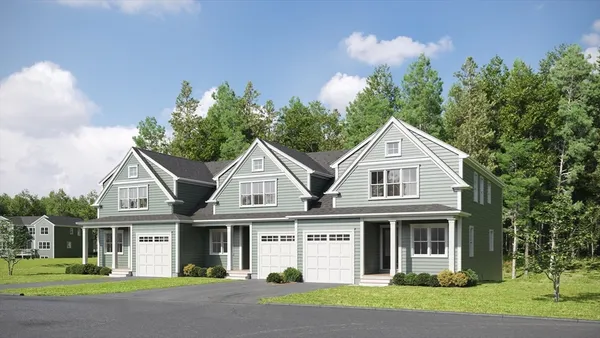 a front view of a house with a yard and trees