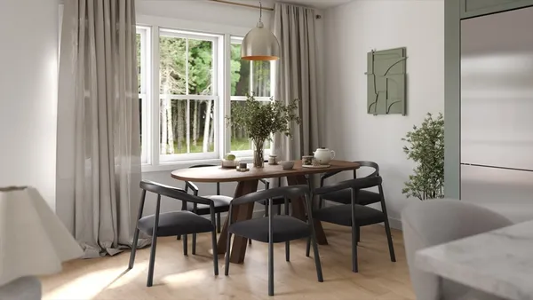 a view of a dining room with furniture and window