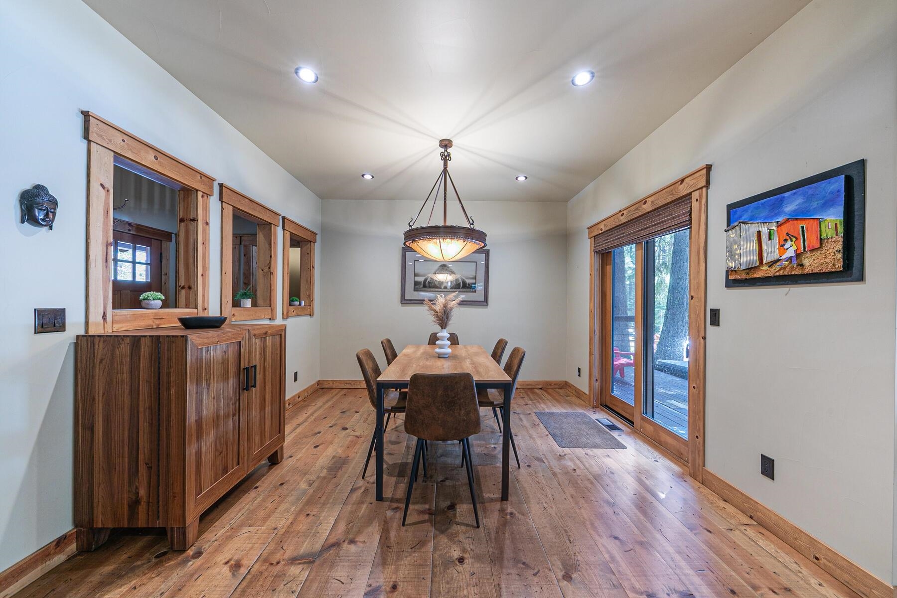 12326 Greenleaf Way Truckee, CA 96161 - Photo 7 of 28 a dining room with furniture a chandelier and wooden floor