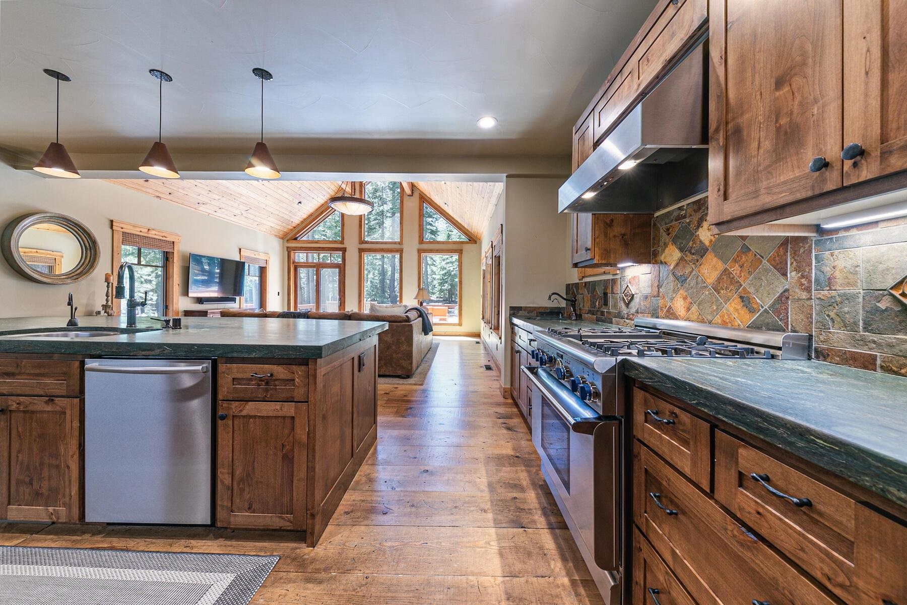 12326 Greenleaf Way Truckee, CA 96161 - Photo 9 of 28 a kitchen with stainless steel appliances granite countertop a stove and a sink