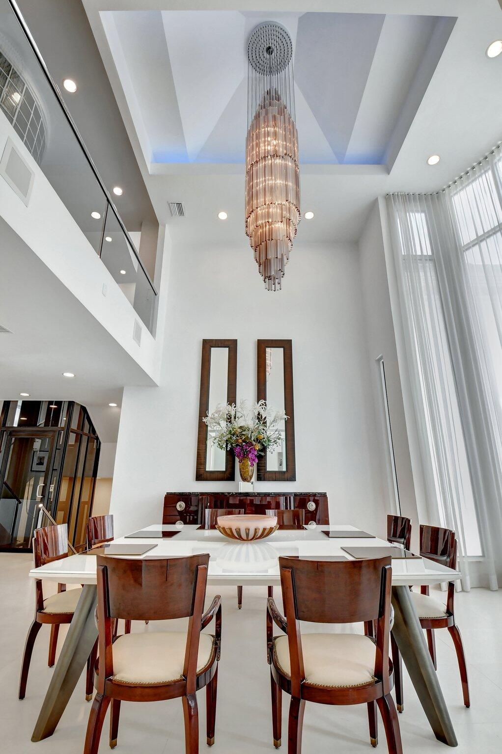 7208 Valencia Drive Boca Raton, FL 33433 - Photo 13 of 73 a dining room with furniture a rug and a chandelier