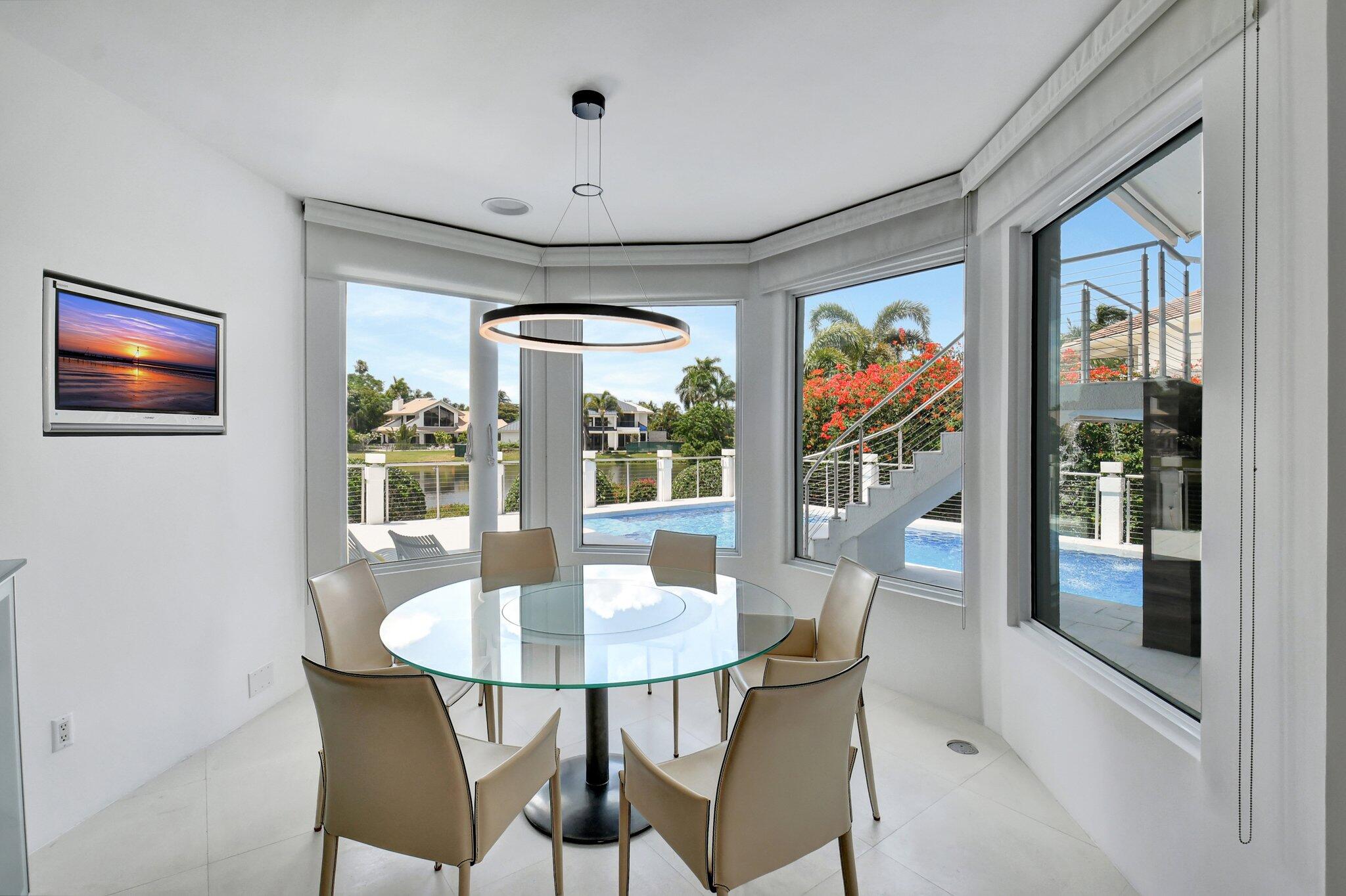 7208 Valencia Drive Boca Raton, FL 33433 - Photo 17 of 73 a dining room with furniture a chandelier and window