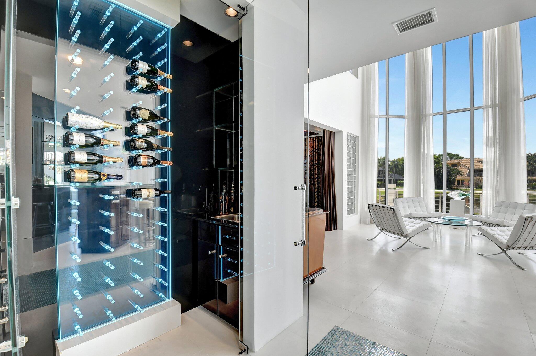 7208 Valencia Drive Boca Raton, FL 33433 - Photo 19 of 73 a view of a living room with a floor to ceiling window and kitchen view