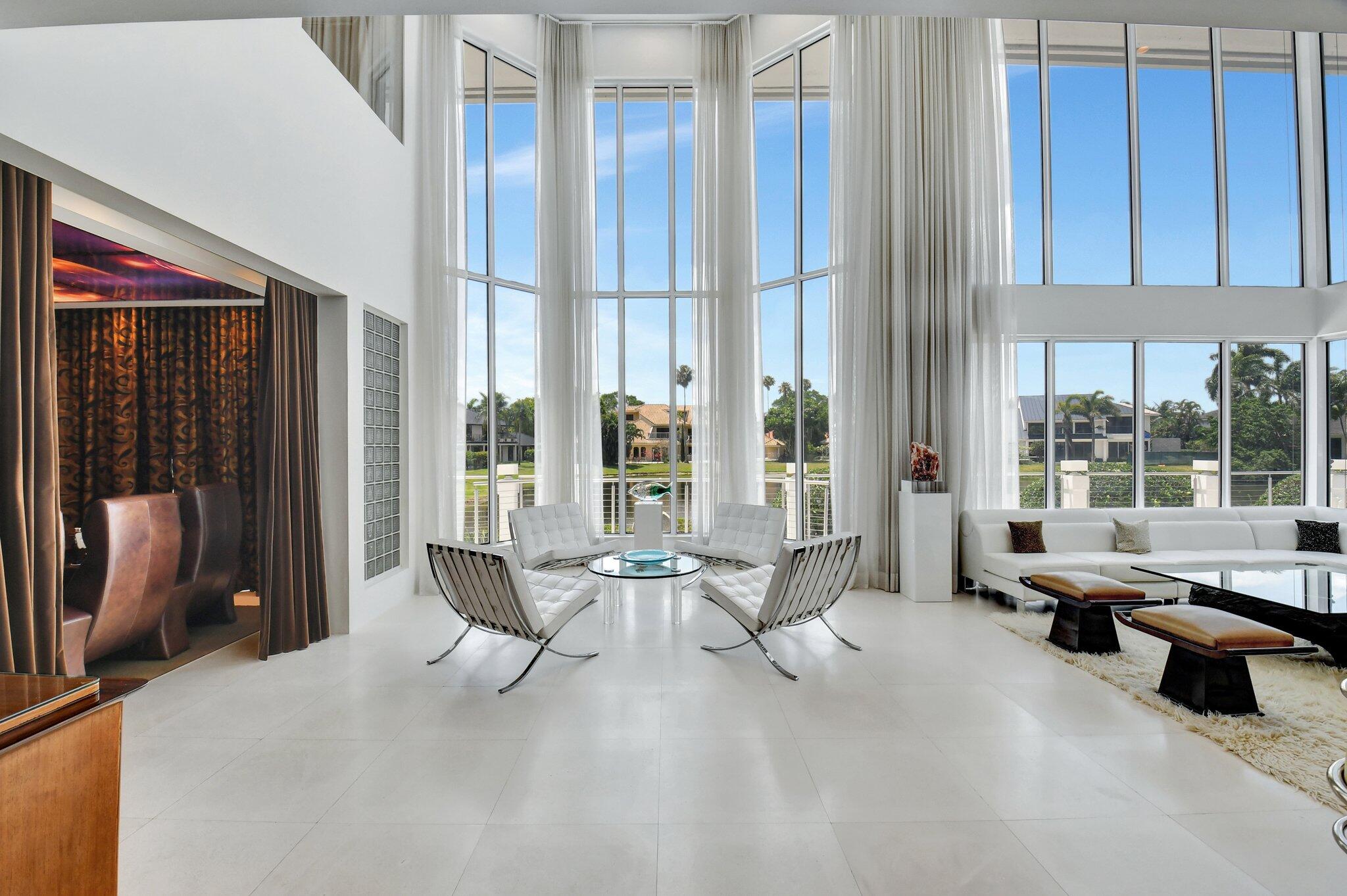 7208 Valencia Drive Boca Raton, FL 33433 - Photo 20 of 73 a living room with furniture and large windows