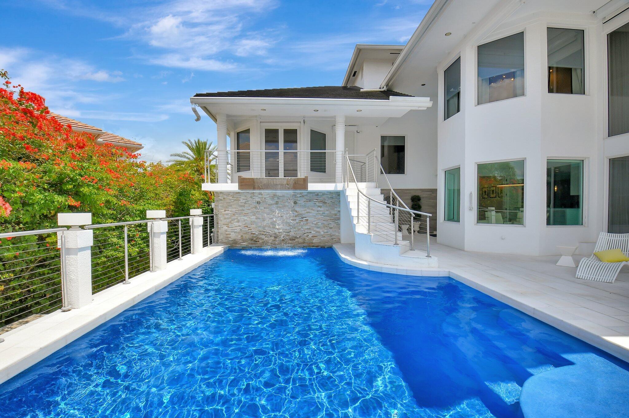 7208 Valencia Drive Boca Raton, FL 33433 - Photo 30 of 73 a view of a house with pool and sitting area