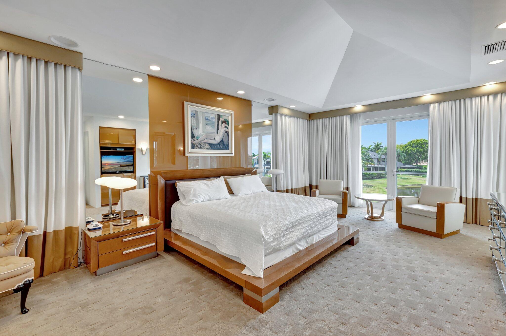 7208 Valencia Drive Boca Raton, FL 33433 - Photo 35 of 73 a spacious bedroom with a bed and large window