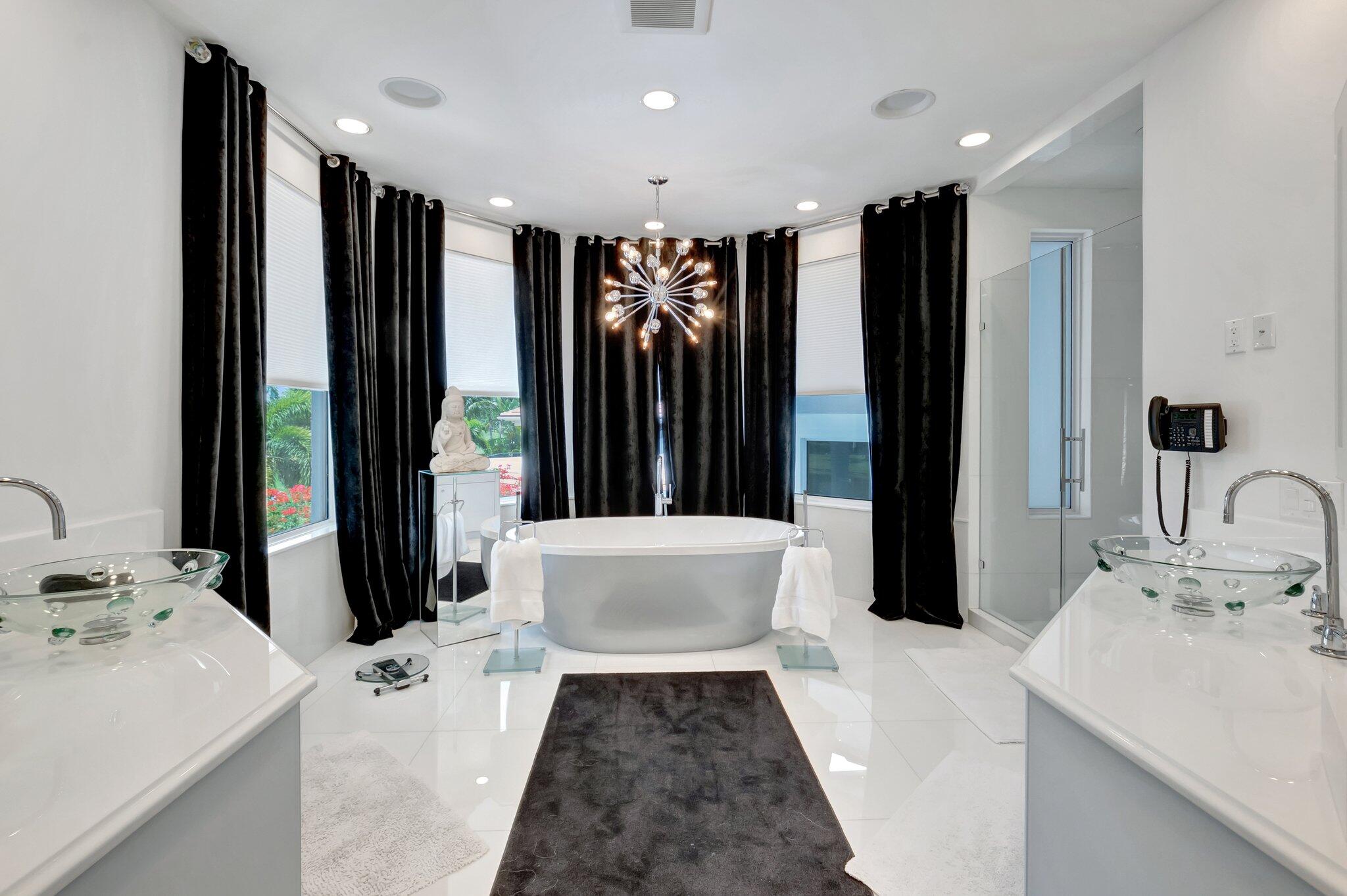 7208 Valencia Drive Boca Raton, FL 33433 - Photo 41 of 73 a bathroom with a double vanity sink a mirror and shower