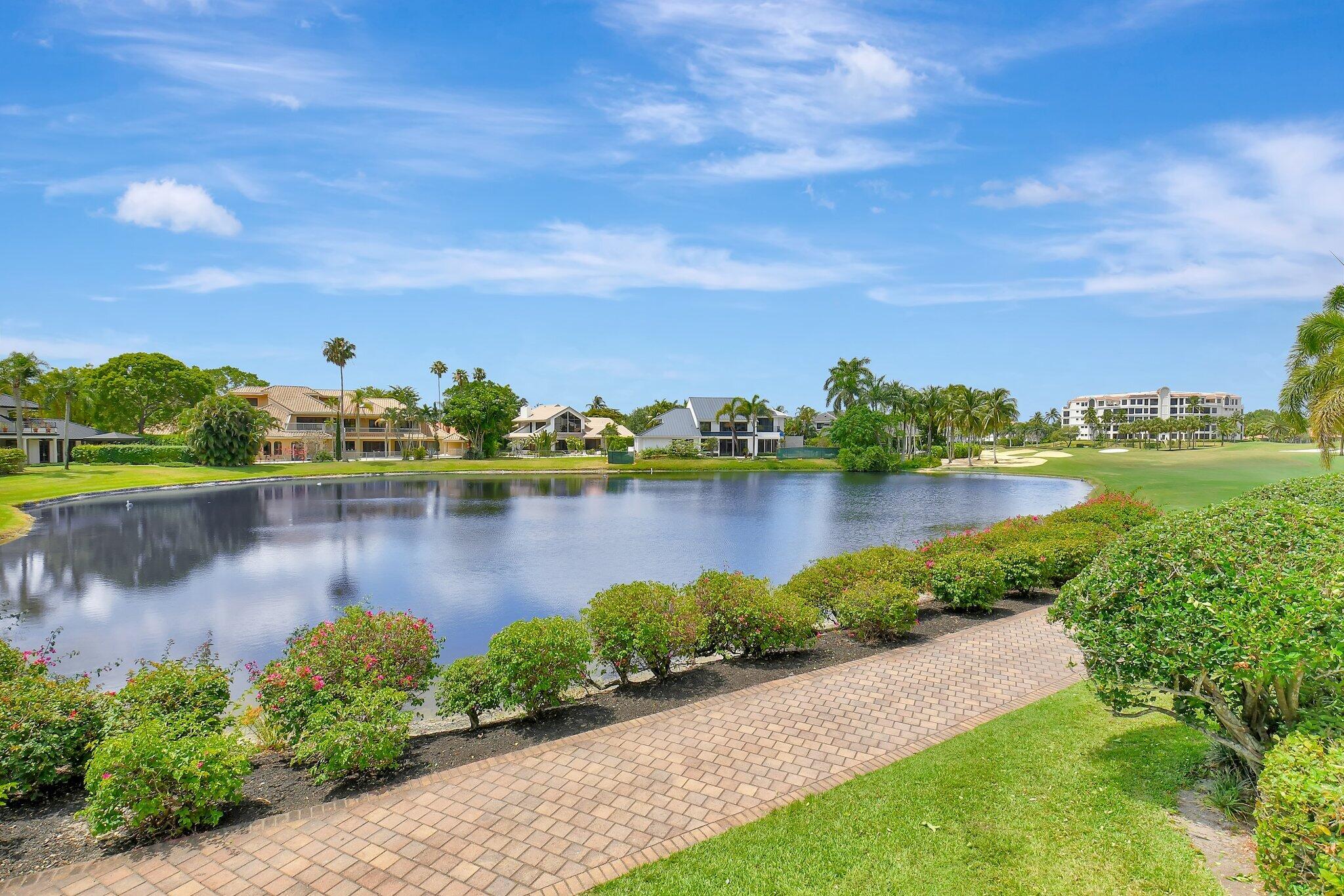 7208 Valencia Drive Boca Raton, FL 33433 - Photo 5 of 73 a view of a lake with houses in the back