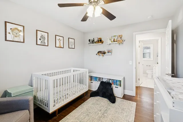 a bedroom with furniture and a wooden floor