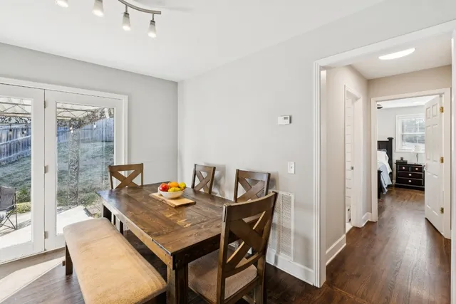 a view of a dining room with furniture and wooden floor