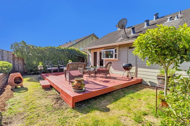 an aerial view of a house with a garden