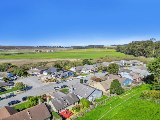 a view of a city with an ocean