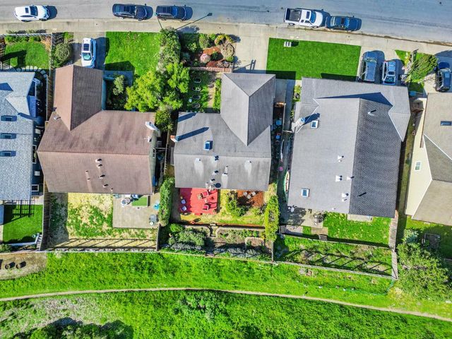 an aerial view of multiple house with outdoor space and swimming pool