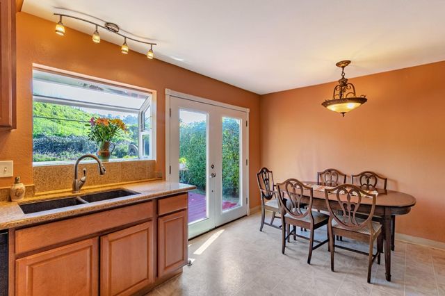 a dining room with a large window and table