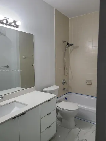 a bathroom with a sink and toilet