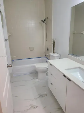 a bedroom with furniture and windows