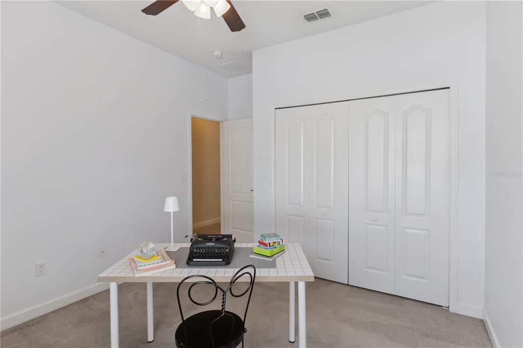 5832 Tarleton Way Mount Dora, FL 32757 - Photo 18 of 31 a room with furniture and a chandelier fan