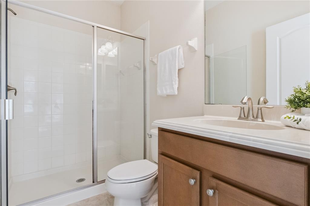 5832 Tarleton Way Mount Dora, FL 32757 - Photo 24 of 31 a bathroom with a sink toilet and shower