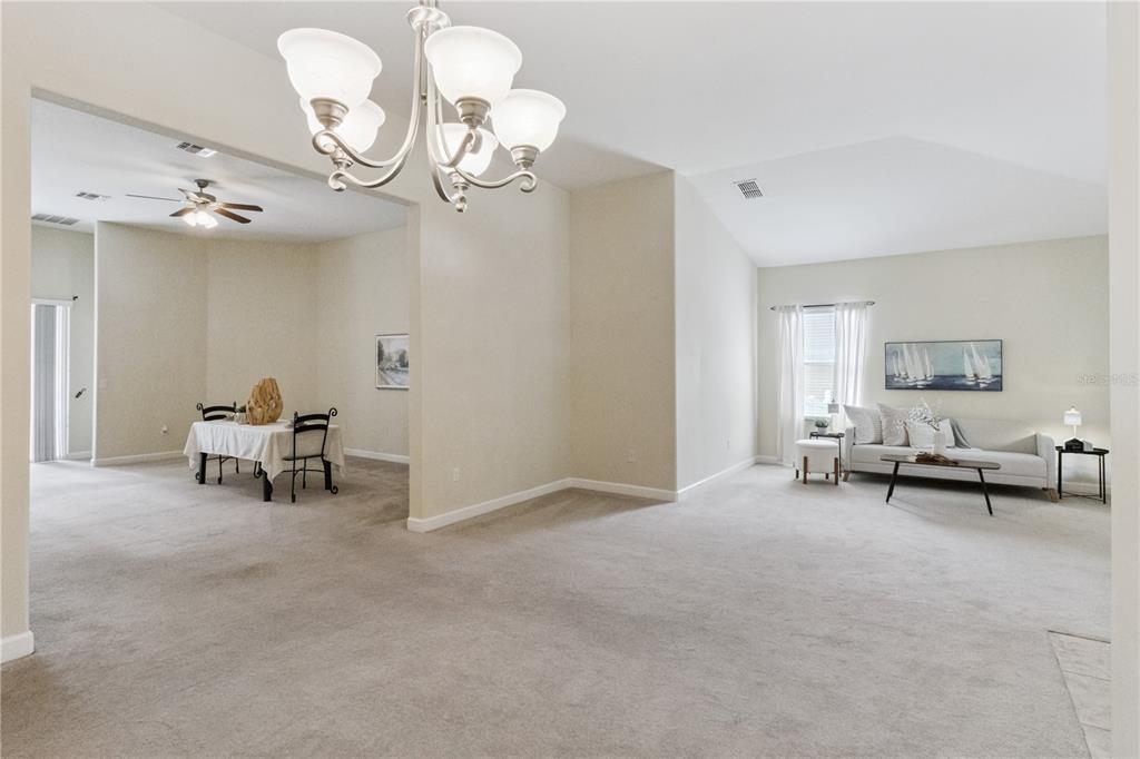 5832 Tarleton Way Mount Dora, FL 32757 - Photo 6 of 31 a view of a livingroom with furniture and a window