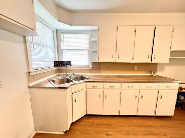 a view of a kitchen with granite countertop cabinets washer and dryer