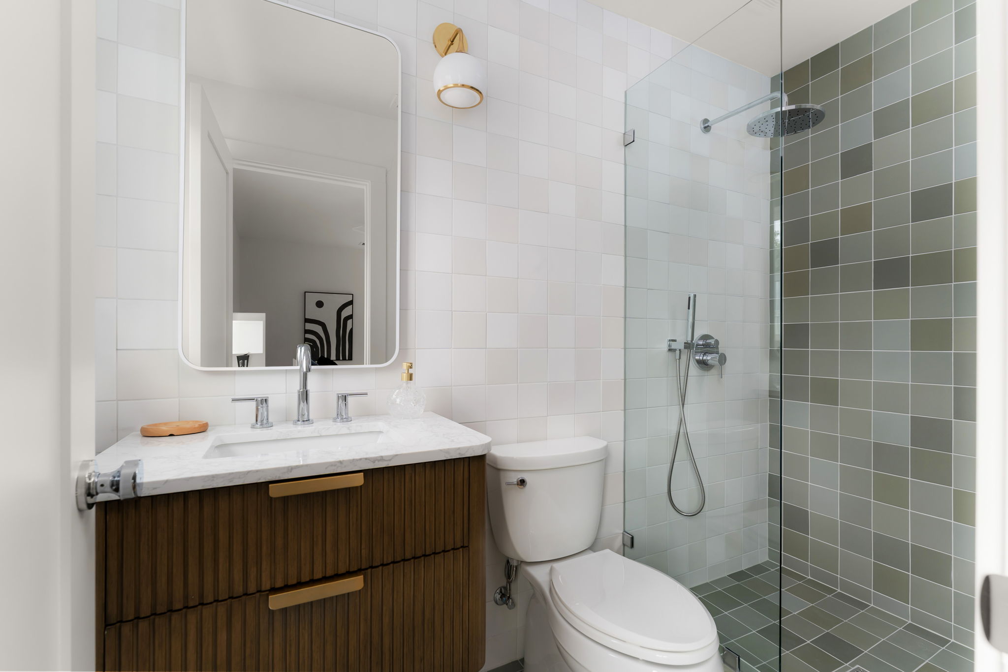 4902 Blueberry Trail, Unit 1 Austin, TX 78723 - Photo 18 of 30 a bathroom with a sink a toilet and shower