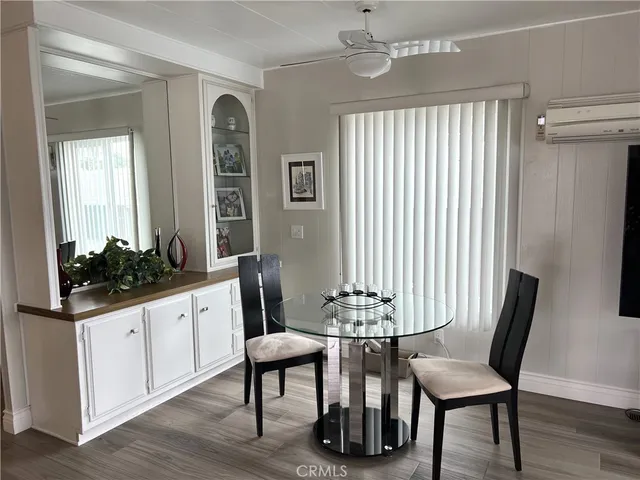 a view of a dining room with furniture and window