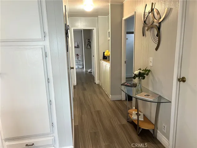 a view of a room with wooden floor