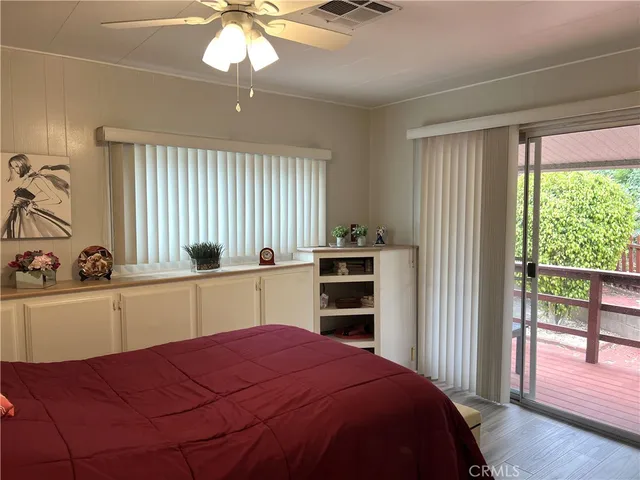 a kitchen with a bed and a window
