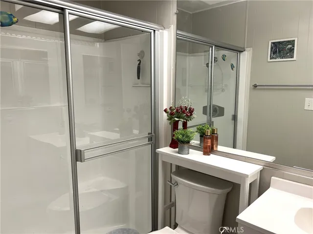 a bathroom with a shower and a sink