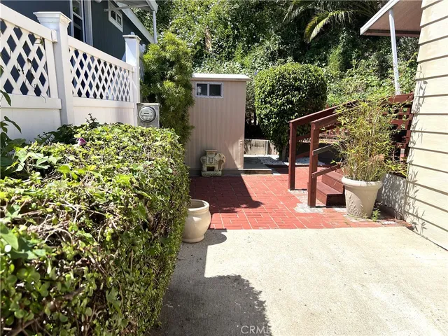 a view of a backyard with sitting area