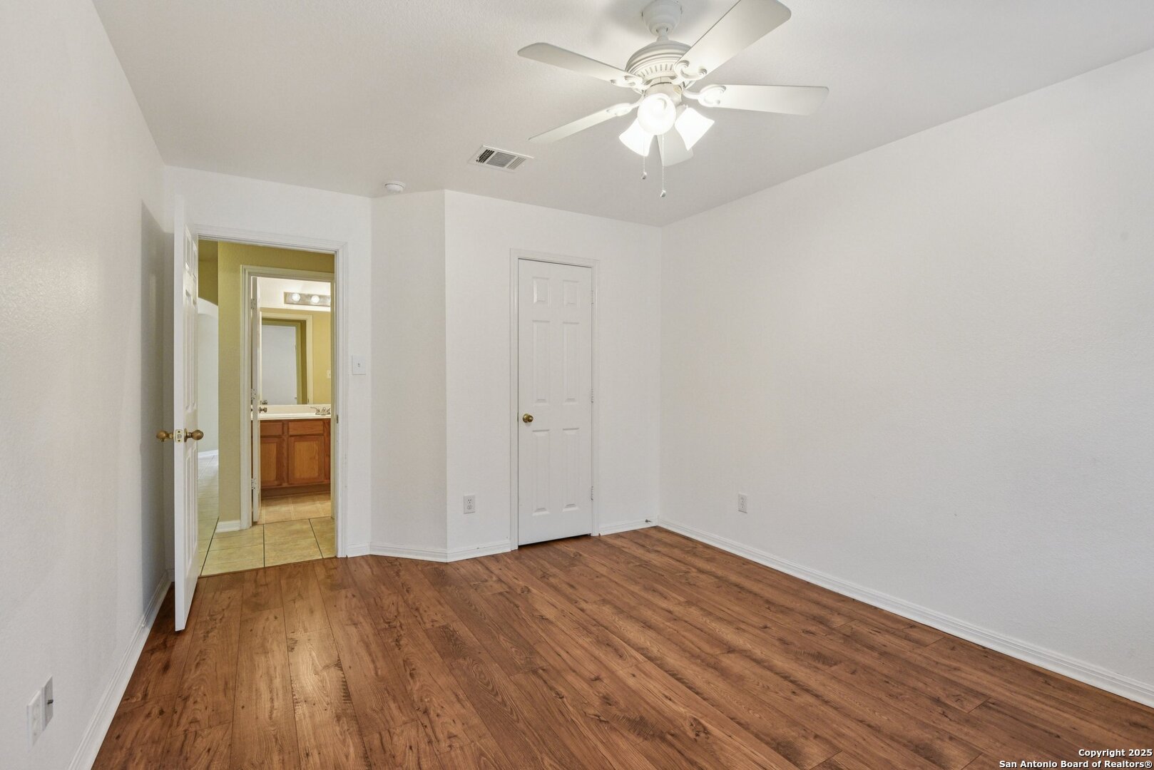 112 Storm Mountain Cibolo, TX 78108 - Photo 25 of 34 wooden floor in an empty room with a window