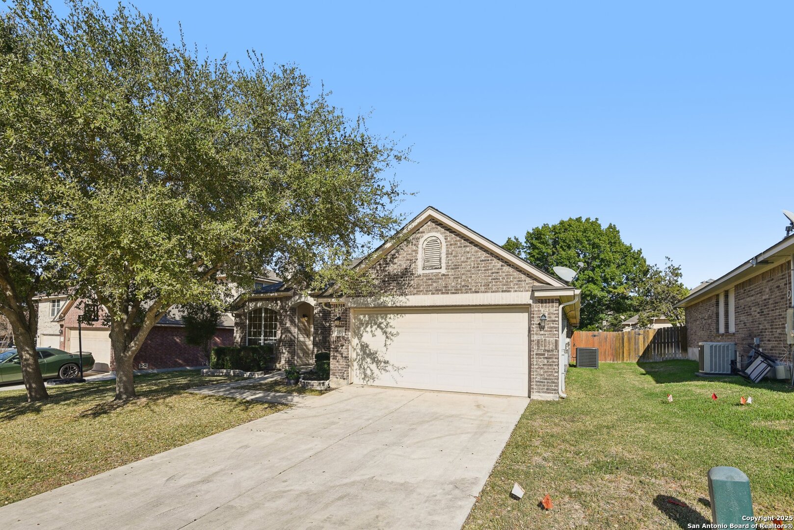 112 Storm Mountain Cibolo, TX 78108 - Photo 33 of 34 a front view of a house with a yard and garage