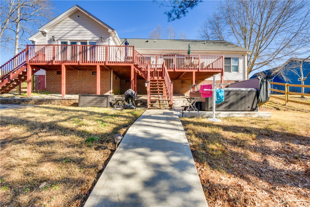 206 Petty Road Seneca, SC 29672 - Photo 35 of 48 A spacious backyard with an elevated deck provides ample outdoor entertaining space and direct access to a relaxing spa.