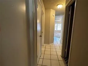 a bathroom with a shower and a mirror