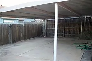 a view of a backyard of the house