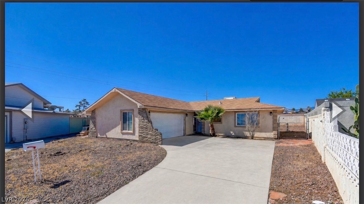 1032 Alan Shepard Street Las Vegas, NV 89145 - Photo 1 of 14 This charming home offers a convenient attached garage and ample driveway parking.