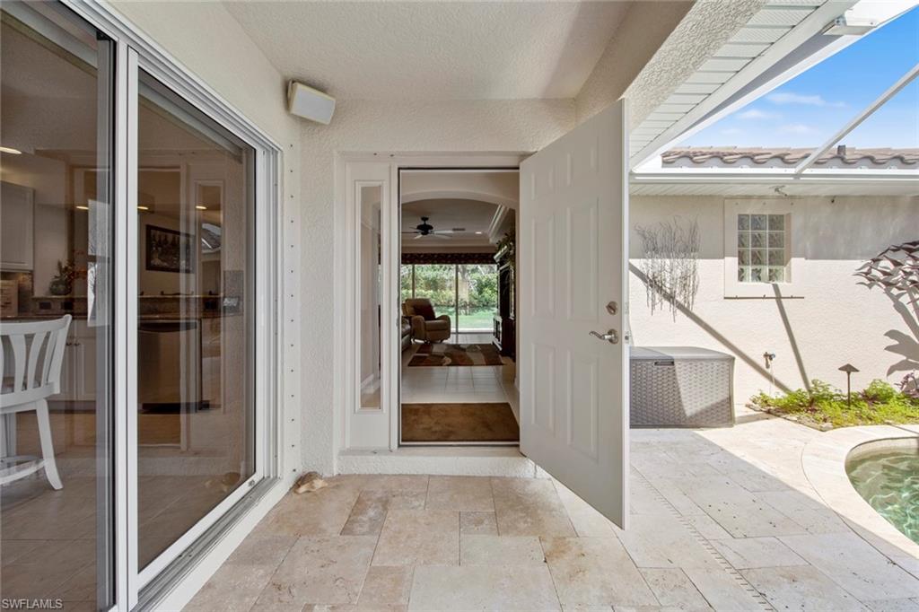 9046 Astonia Way Estero, FL 33967 - Photo 11 of 47 a view of a glass door of a house