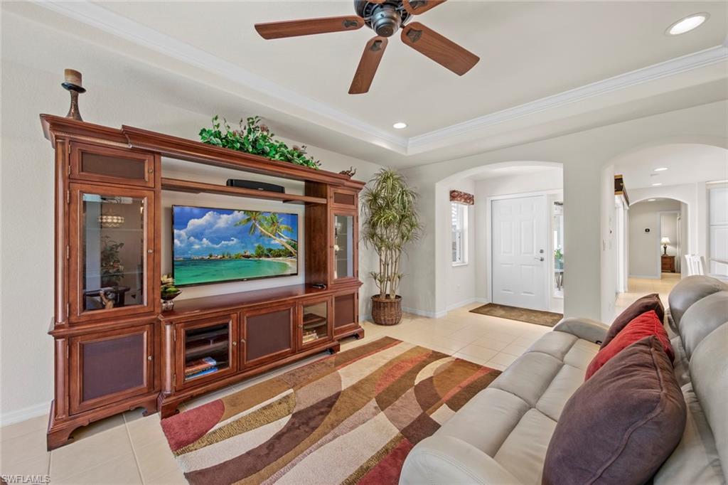 9046 Astonia Way Estero, FL 33967 - Photo 12 of 47 a living room with furniture and a flat screen tv